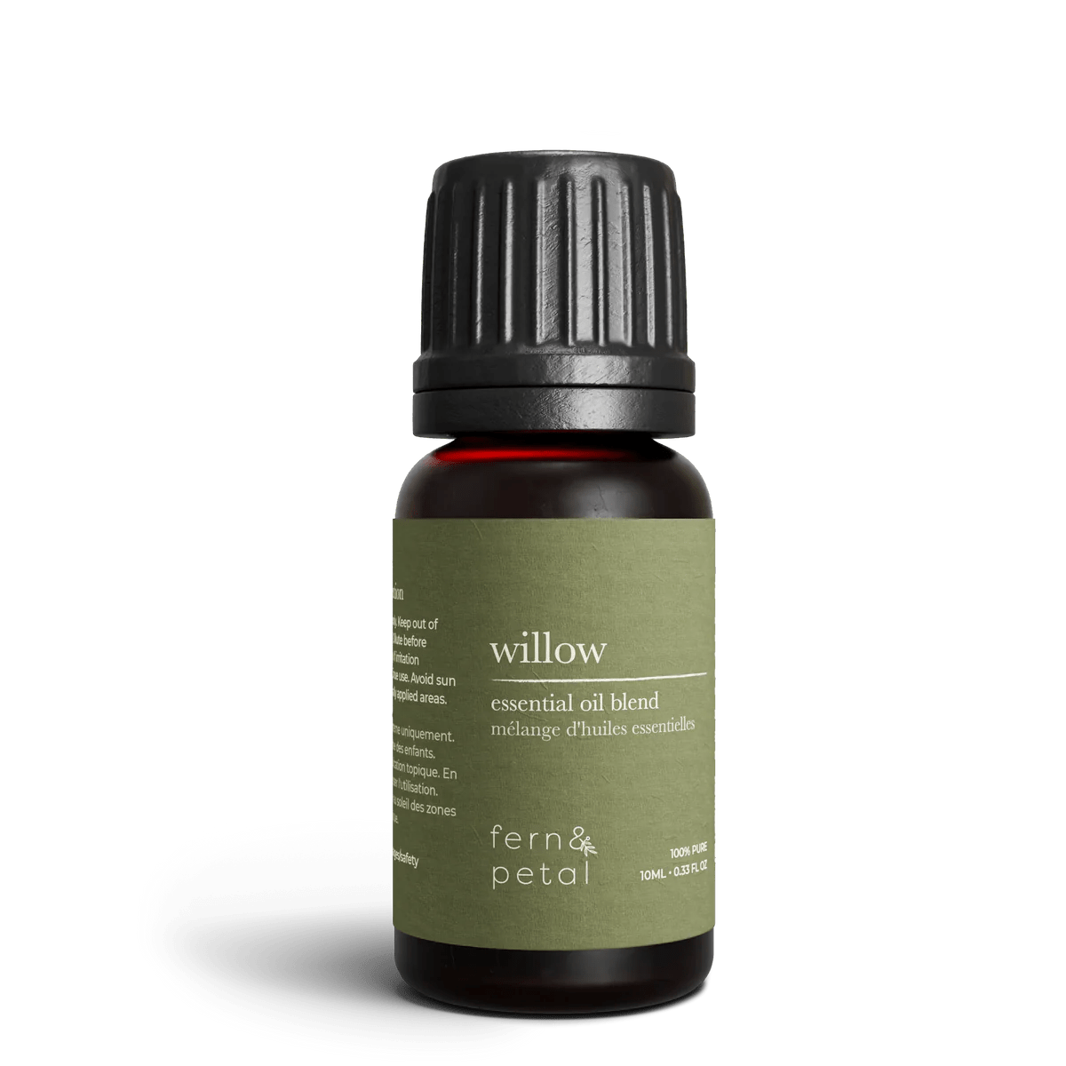 Close-up of Fern & Petal Willow Essential Oil Blend bottle showing green label details.