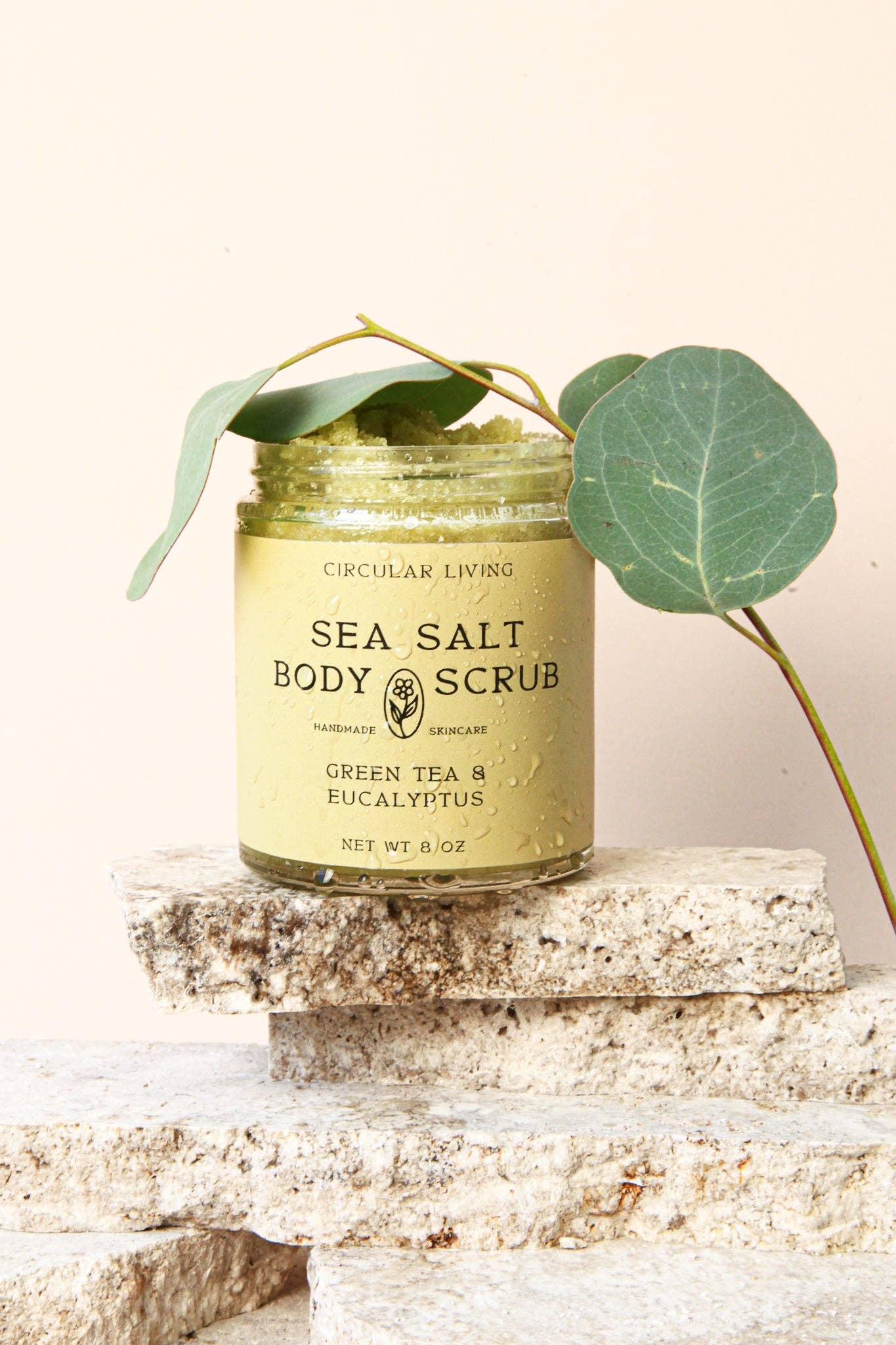 Open jar of Circular Living Sea Salt Body Scrub with Green Tea and Eucalyptus, clean beauty exfoliating scrub.