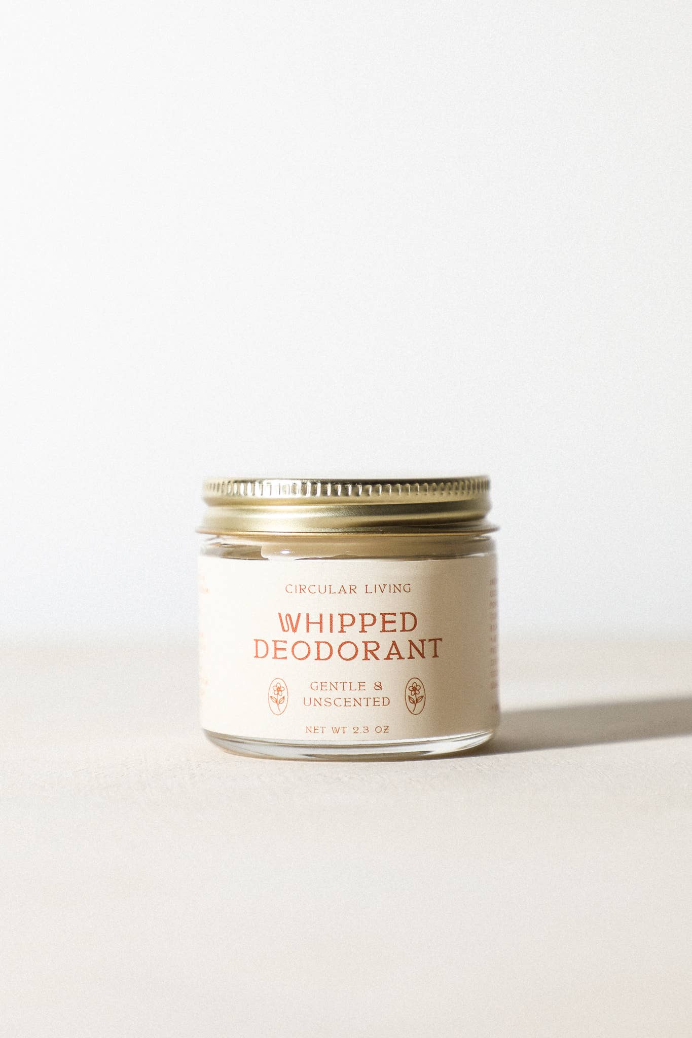 Circular Living Whipped Deodorant Gentle Unscented shown in glass jar on neutral background.