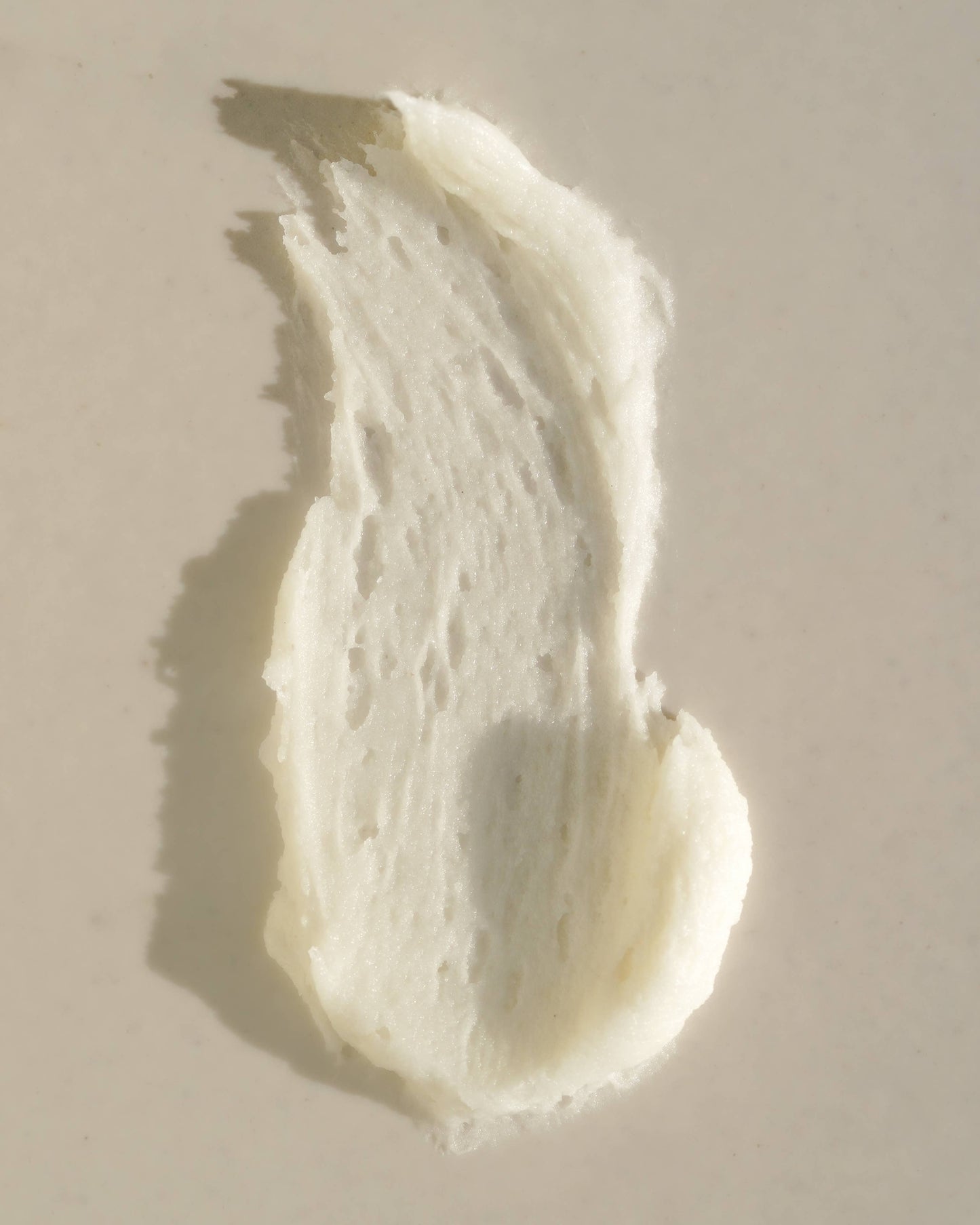 Texture close-up of Circular Living Whipped Deodorant Gentle Unscented, natural personal care product.