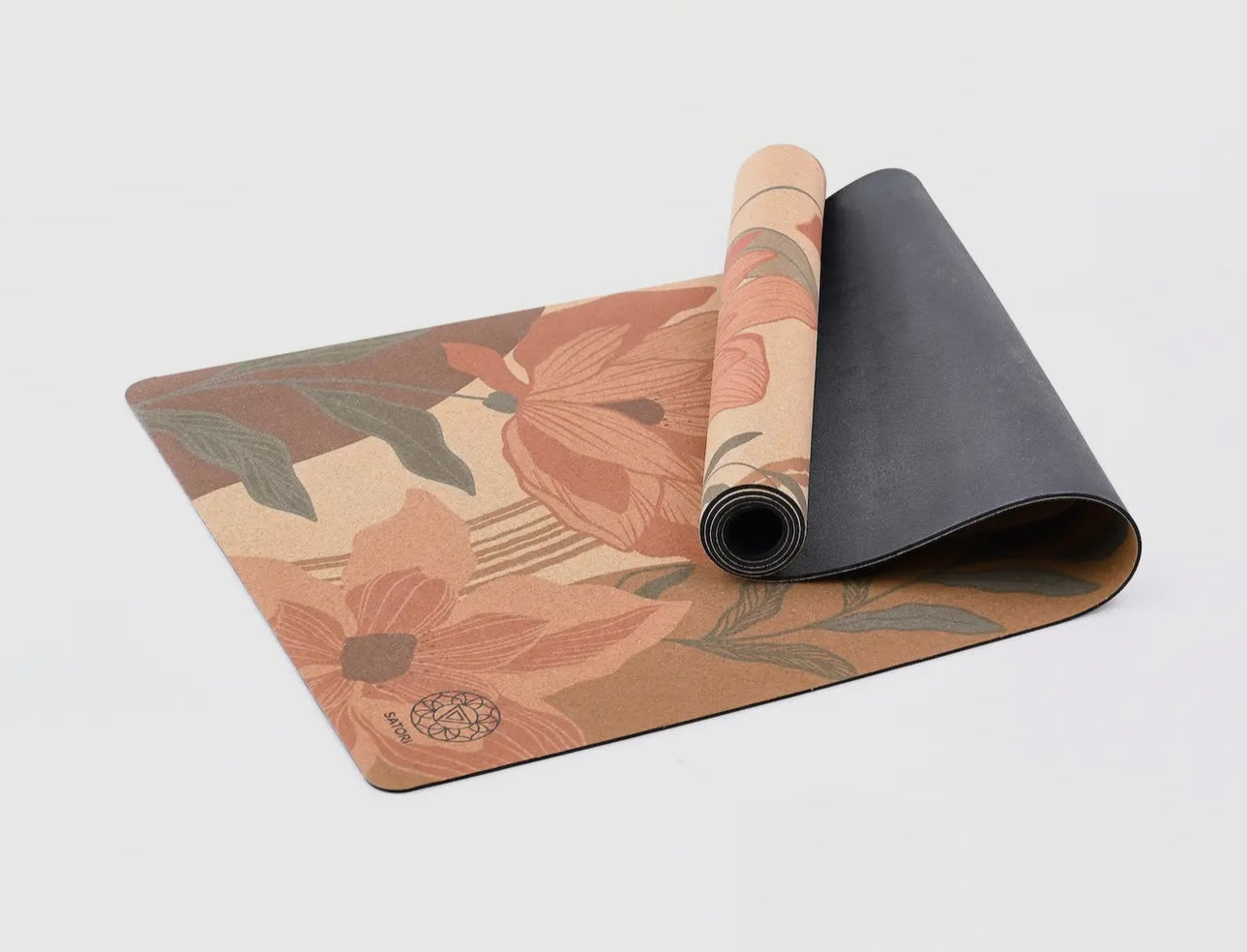 Satori Concept Garden of Flowers cork yoga mat partially rolled with curled edge view.