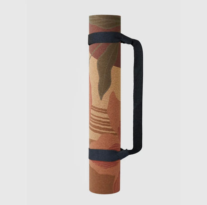Satori Concept Garden of Flowers cork yoga mat rolled up with carrying strap attached.