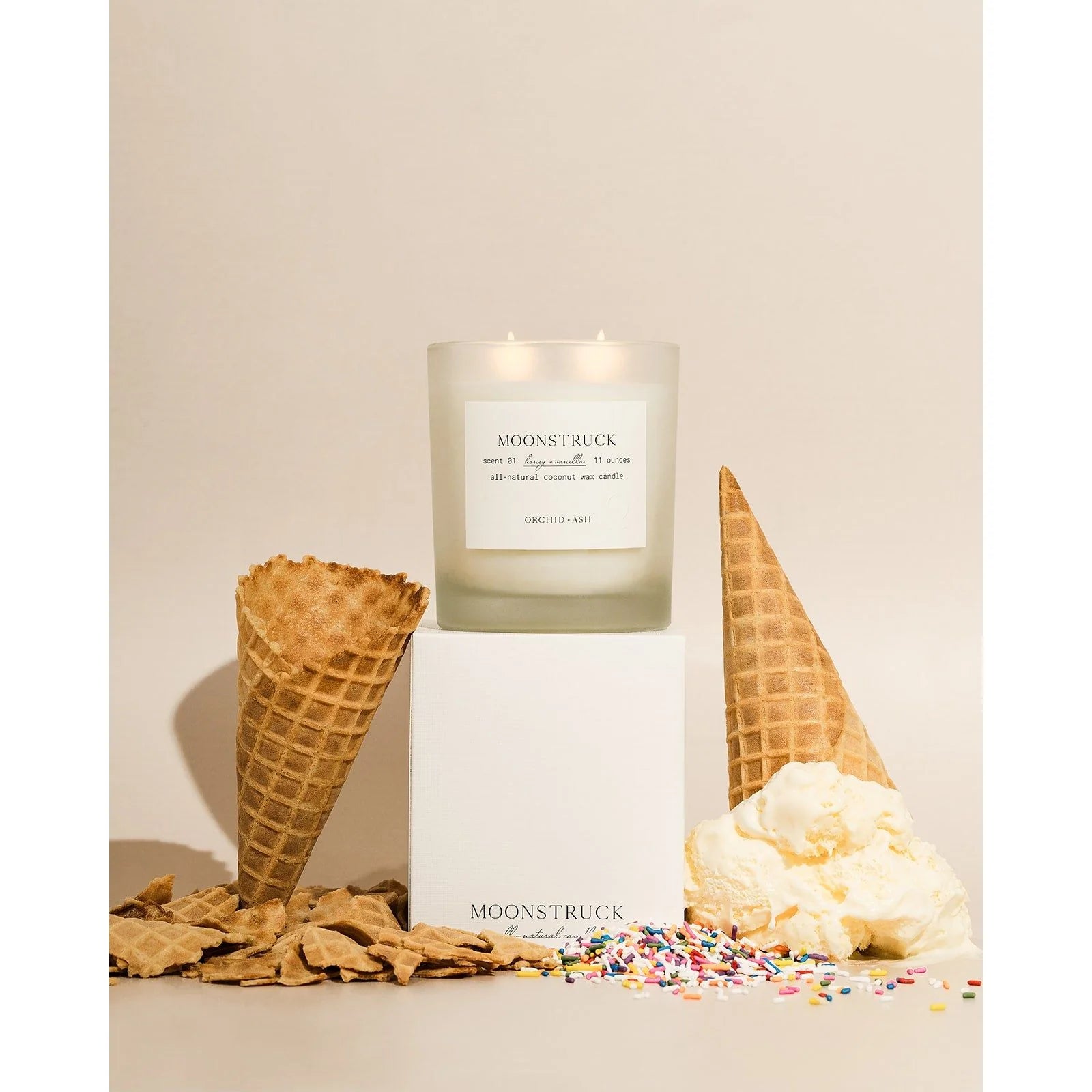 Moonstruck candle by Orchid & Ash styled with box packaging adn ice cream cones with colorful rainbow sprinkles.