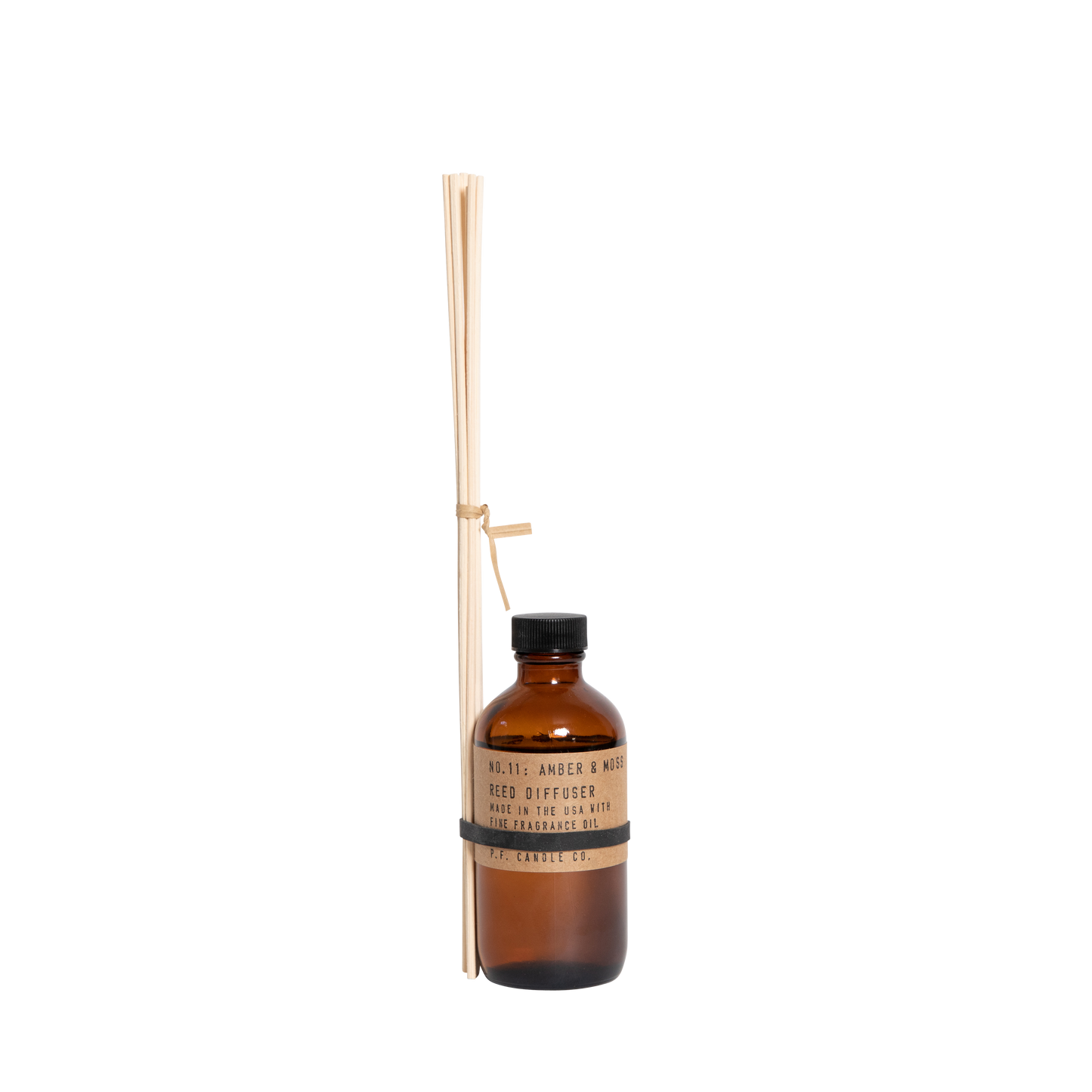 P.F. Candle Co. Amber & Moss reed diffuser with bundled diffuser sticks tied to the bottle.