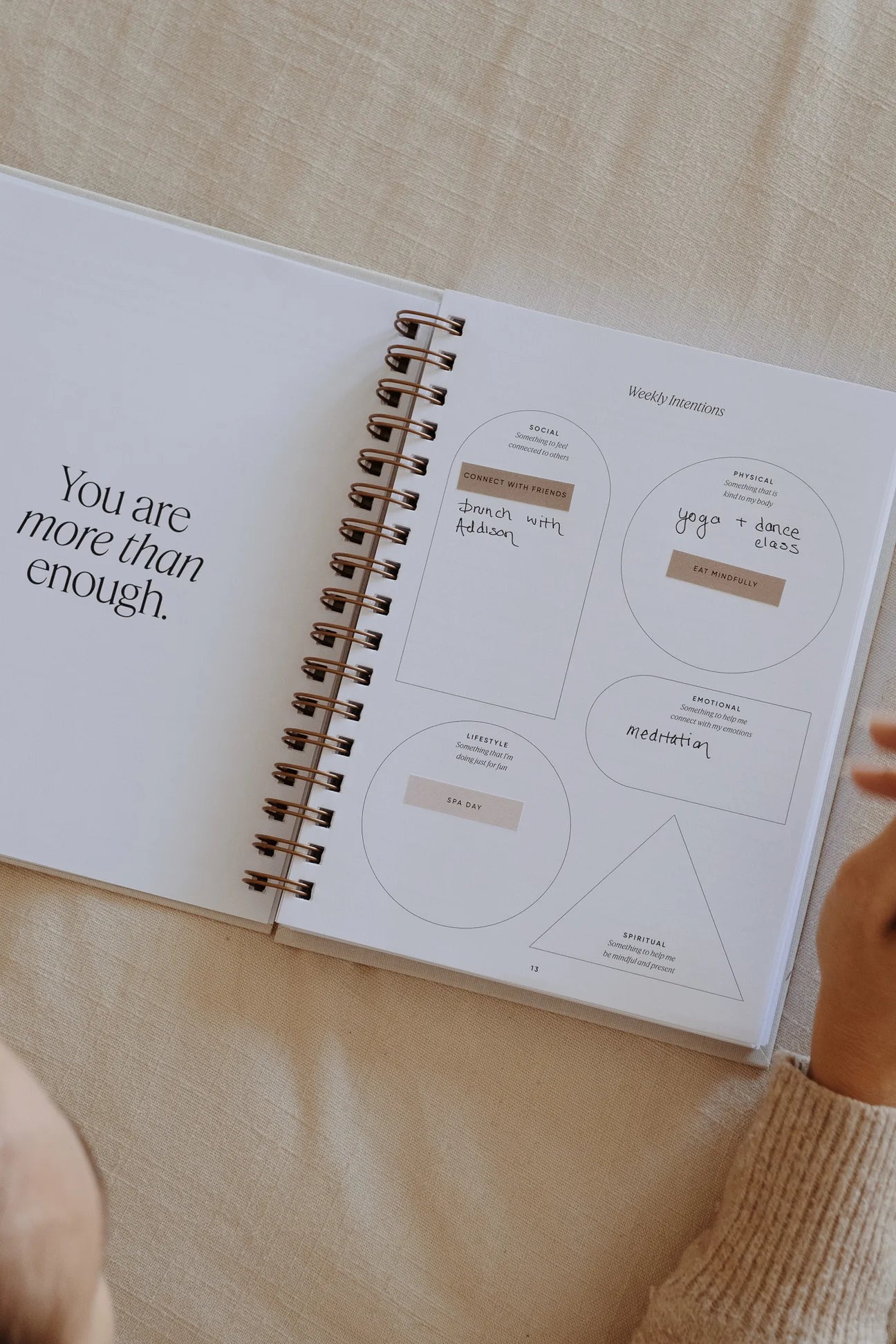 Simple Self Co guided Inner Work Journal or daily planner open with stickers applied to the pages.