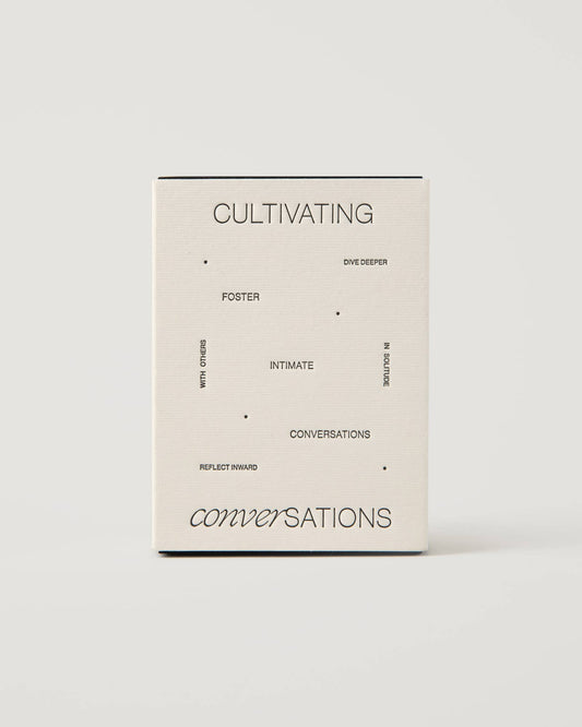 Front of the Wilde House Paper Cultivating Conversations Card Deck box on neutral background.