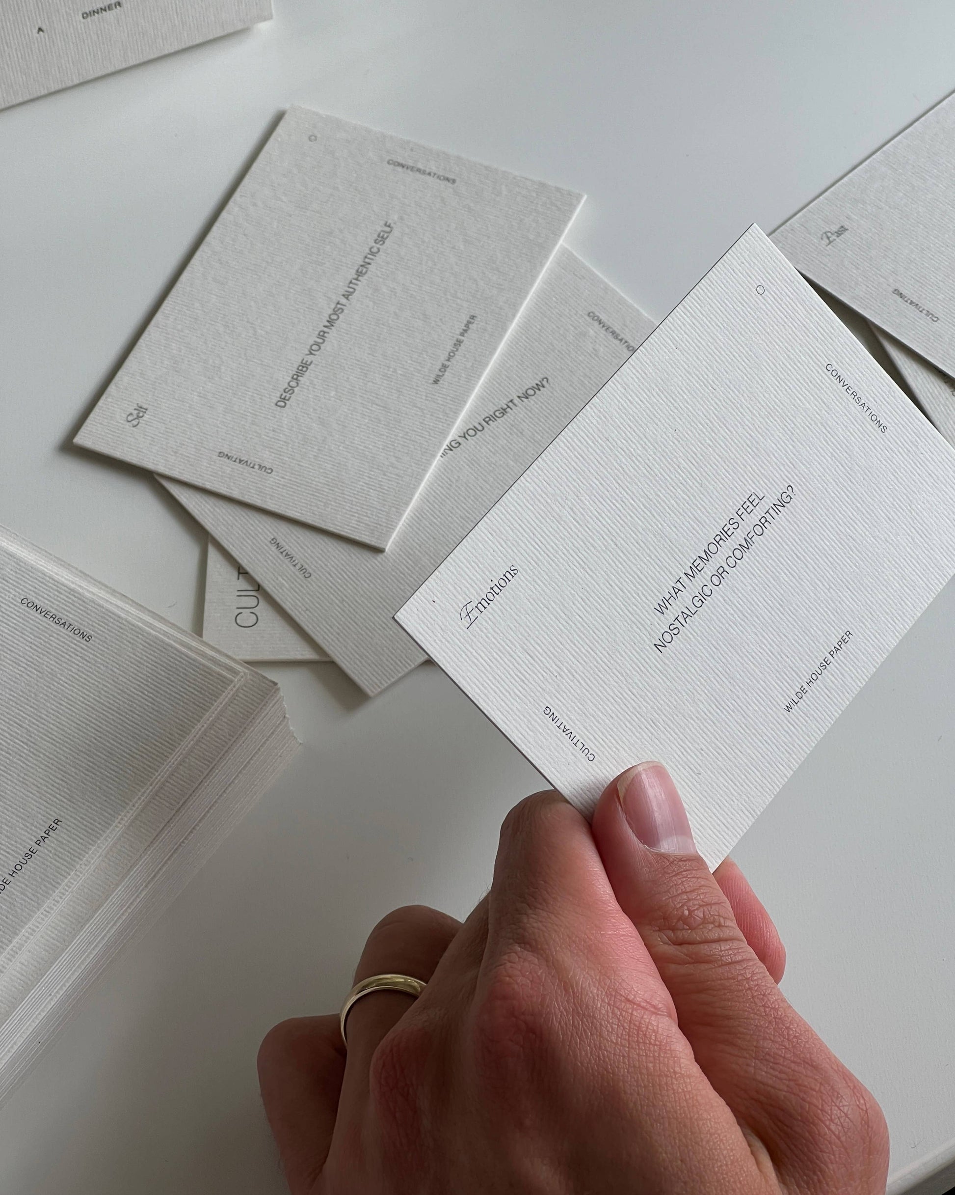 Close-up of Wilde House Paper Cultivating Conversations card showing a thoughtful question prompt.
