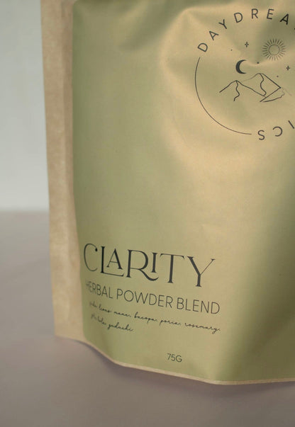 Daydream Organics Clarity Herbal Powder Blend close-up image of green label on a neutral background.