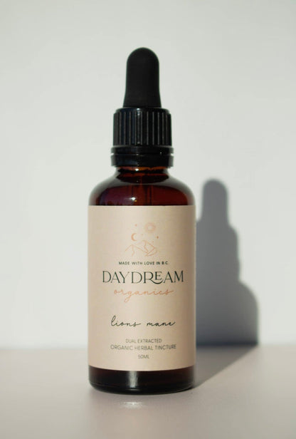 Close-up of Lion’s Mane mushroom tincture bottle by Daydream Organics against a white background.