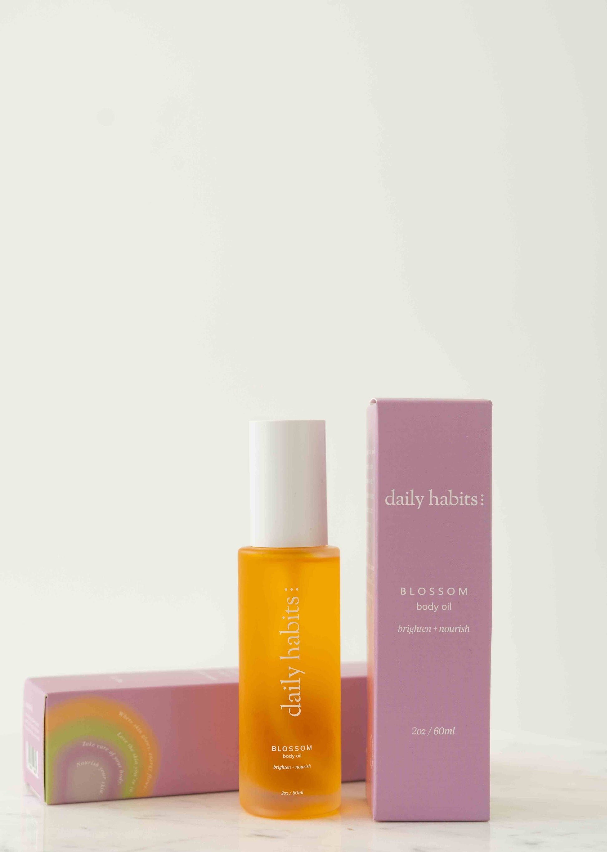Organic Blossom Body Oil in elegant packaging, featuring Daily Habits’ nourishing formula.