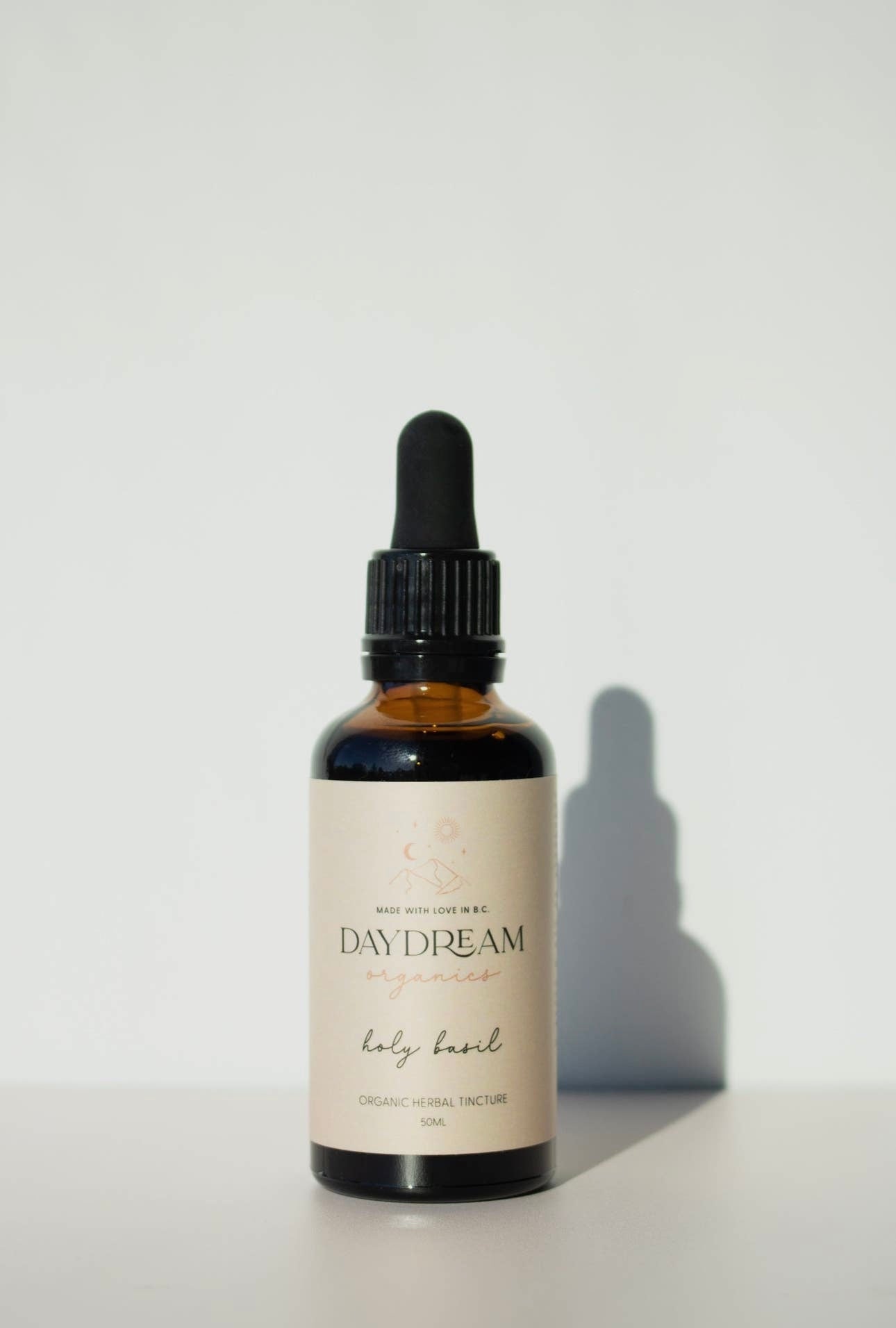 Daydream Organics Holy Basil Tulsi Tincture bottle close-up.