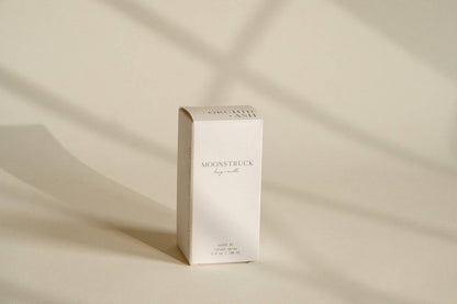 White packaging box for Orchid & Ash room spray against a neutral background.