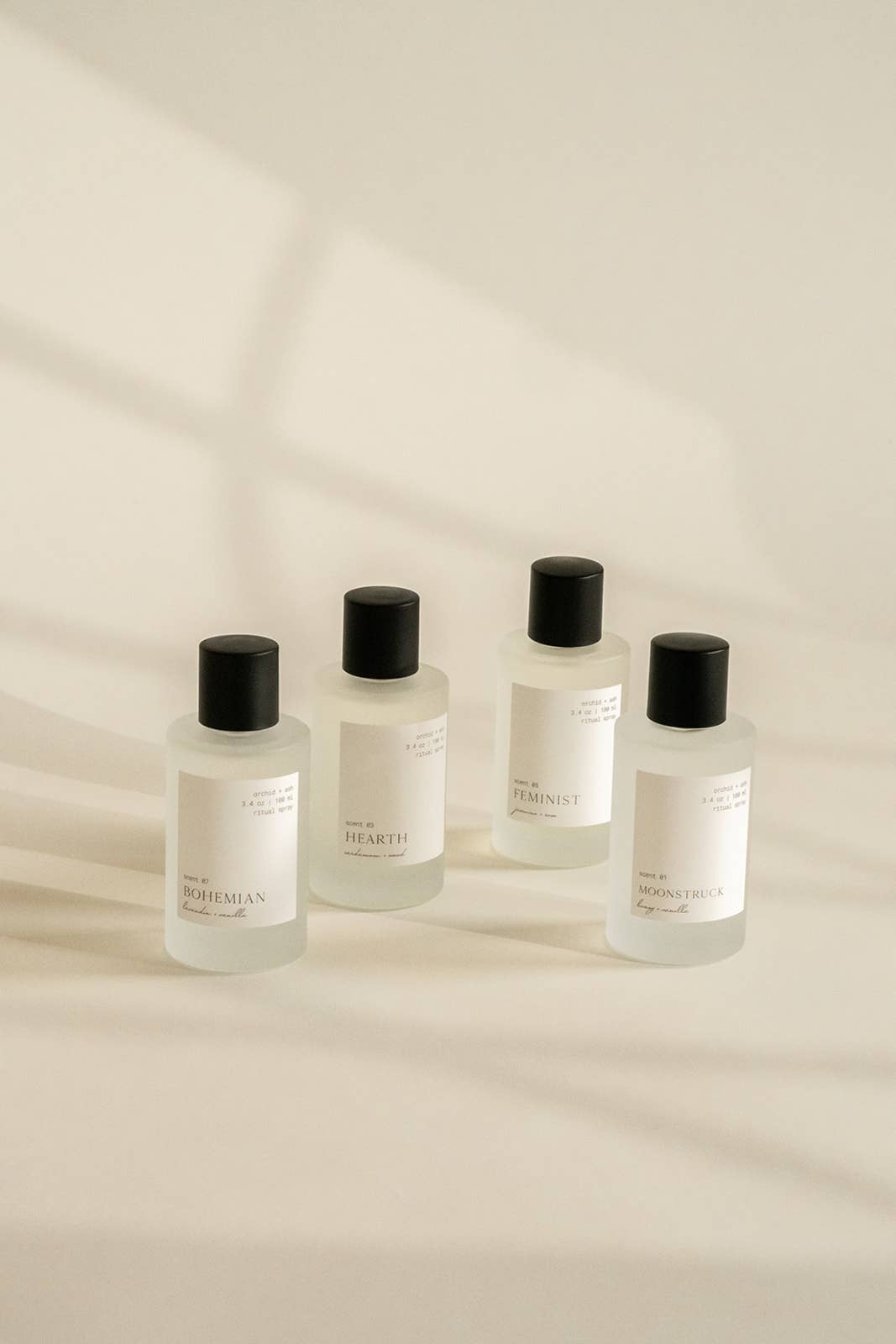 Lineup of Orchid & Ash room sprays including Joshua Tree, Bohemian, Hearth, and Feminist.
