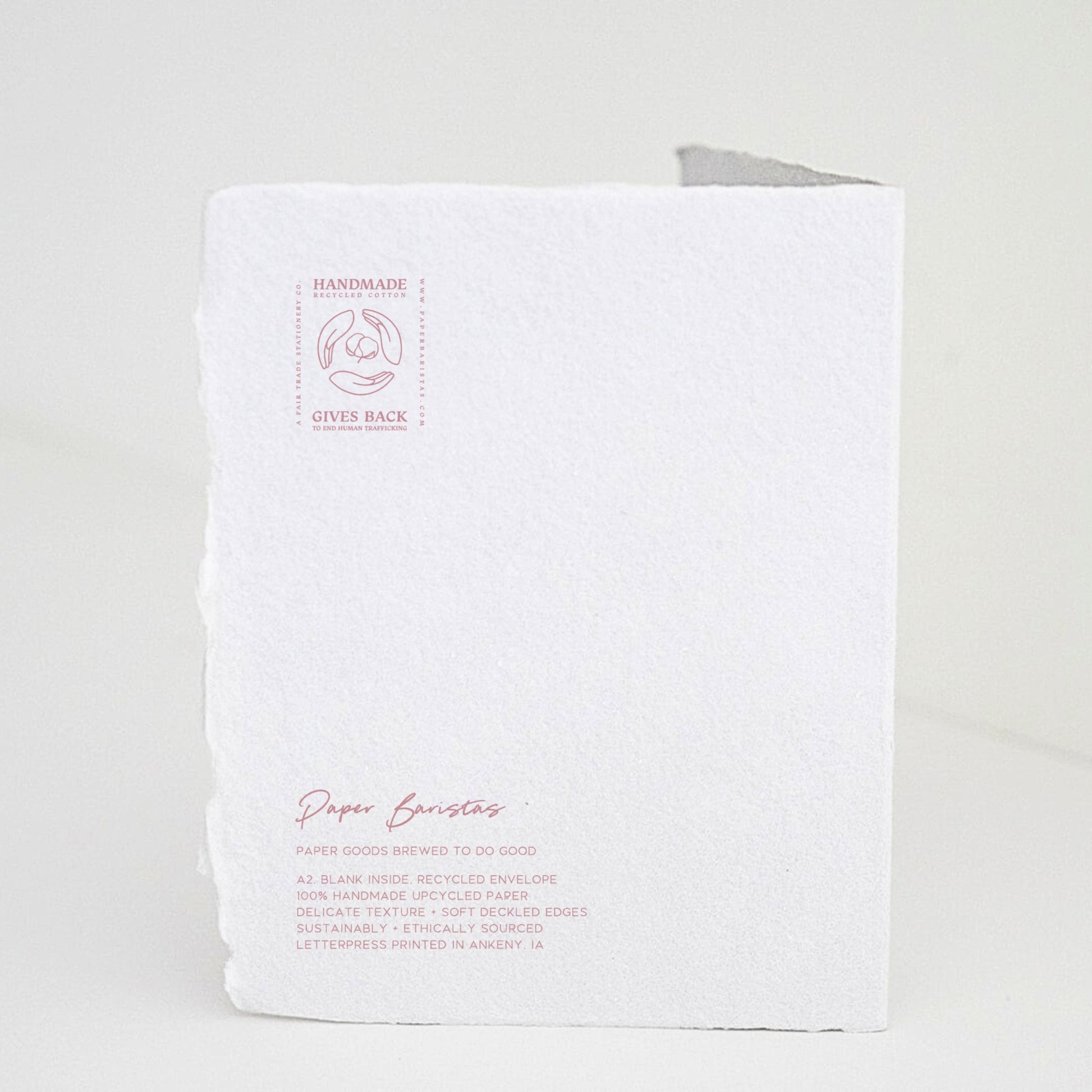 Back of Paper Baristas "Bundle of Joy Girl" greeting card with letterpress details and ethical production message in pink ink.