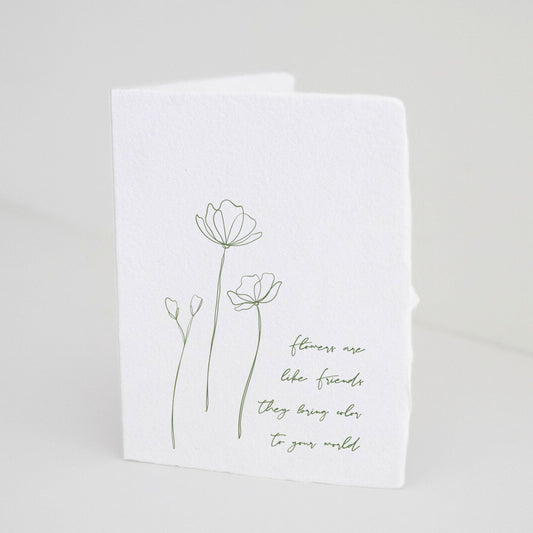 Paper Baristas minimalist greeting card with green illustration of blooming wildflowers and quote: "Flowers Are Like Friends They Bring Color To Your World" in green ink on handmade eco-friendly recycled cotton paper.