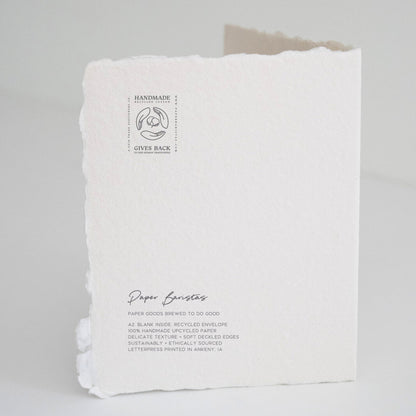 Back of Paper Baristas "You Two Make The Perfect Blend, Congrats On The New Baby" greeting card with letterpress details and ethical production message.