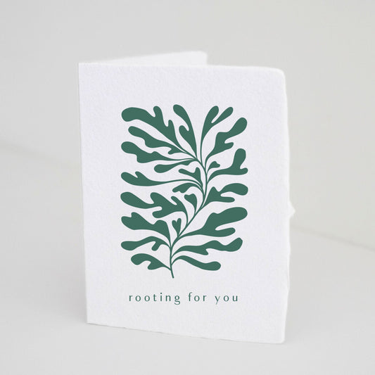 Paper Baristas handmade greeting card with deep green foliage illustration and the phrase “Rooting For You” printed on recycled eco-friendly white cotton paper.