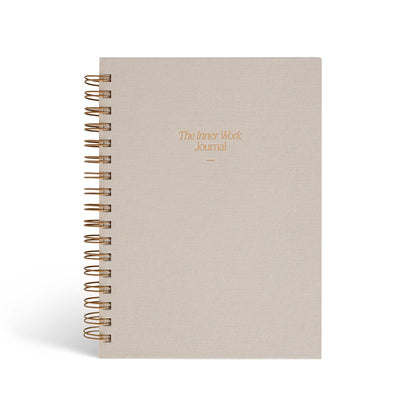 The Inner Work Journal in a beige sand hardcover with gold foil lettering, shown against a white background.