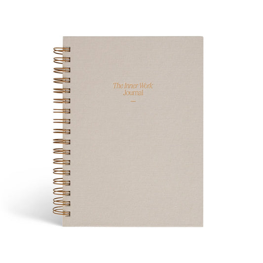 The Inner Work Journal in a beige sand hardcover with gold foil lettering, shown against a white background.