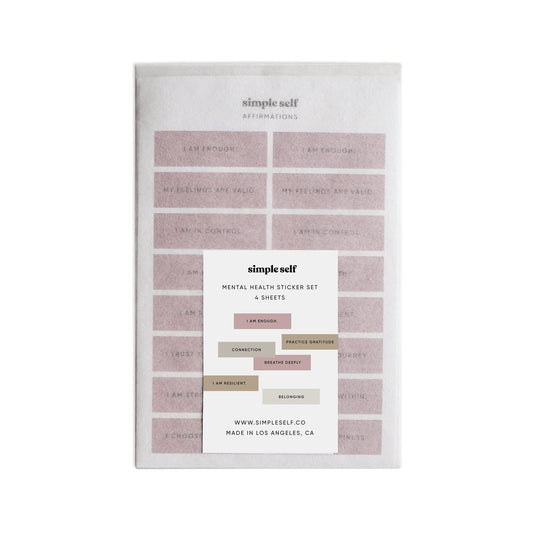 Mental Health Sticker Set by Simple Self Co shown flat in packaging, with sheets of affirmations and prompts.