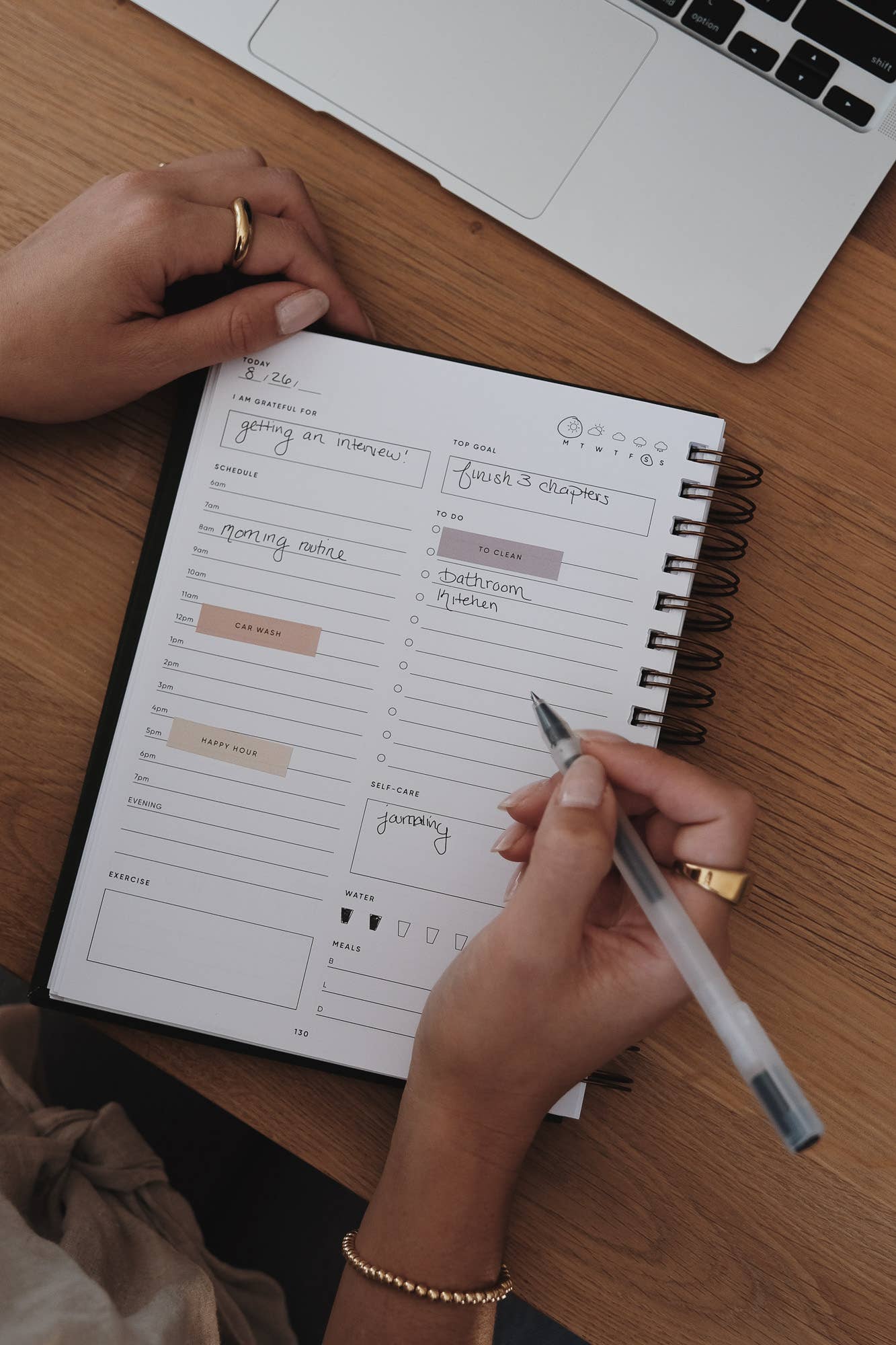 Simple Self Co Work Sticker Set in use on a daily planner with a person writing notes.