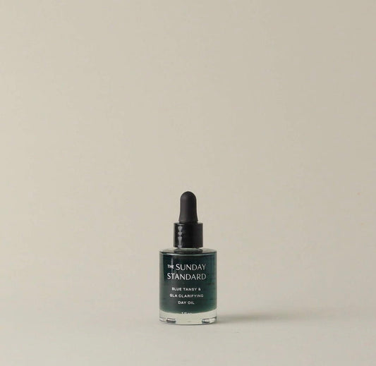 The Sunday Standard Blue Tansy & GLA Clarifying Day Oil in a glass dropper bottle on a neutral background.