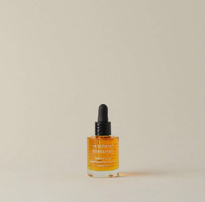 Minimalist product shot of The Sunday Standard Rosehip & Sea Buckthorn Restorative Night Oil bottle.