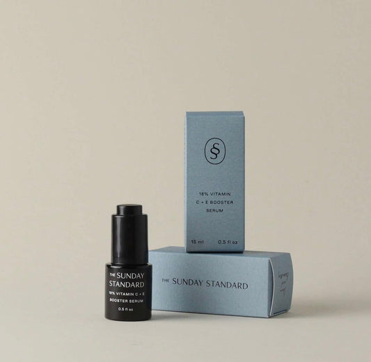 The Sunday Standard Brightening 18% Vitamin C and E Booster Serum with its blue box packaging displayed upright.
