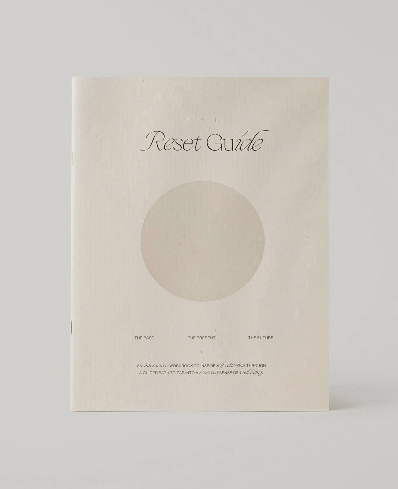 The Reset Guide by Wilde House Paper standing upright on a neutral background.